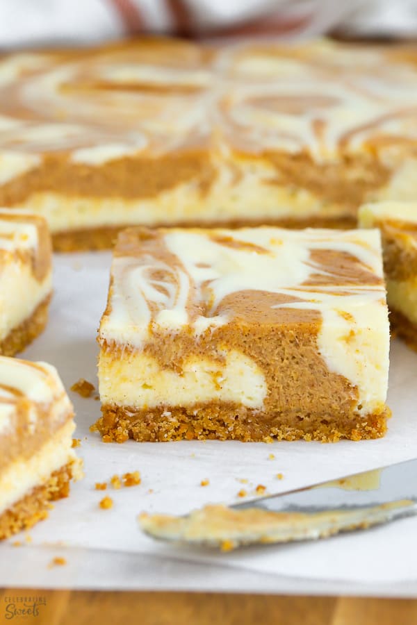 These swirling pumpkin cheesecake bars feature graham cracker crust, pumpkin pie and creamy cheesecake flavors.