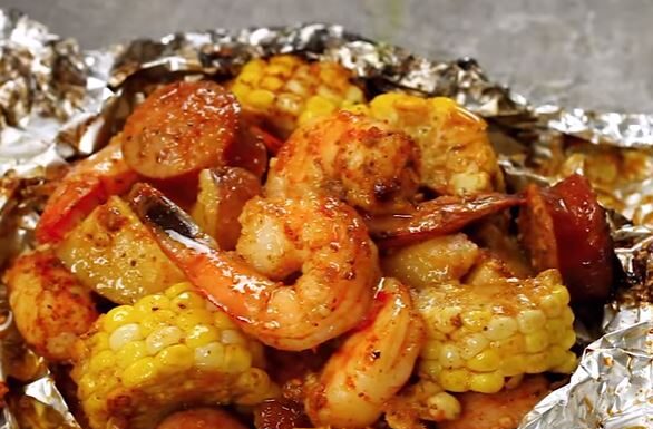 SHRIMP BOIL FOIL PACKETS. Packed with shrimp, andouille sausage, corn on the cob, and baby red potatoes, you have a full meal right in these packets, packed with so much flavor and just the right amount of heat.