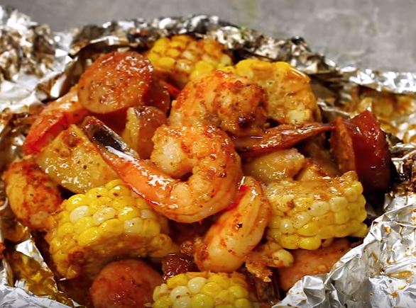 SHRIMP BOIL FOIL PACKETS. Packed with shrimp, andouille sausage, corn on the cob, and baby red potatoes, you have a full meal right in these packets, packed with so much flavor and just the right amount of heat.